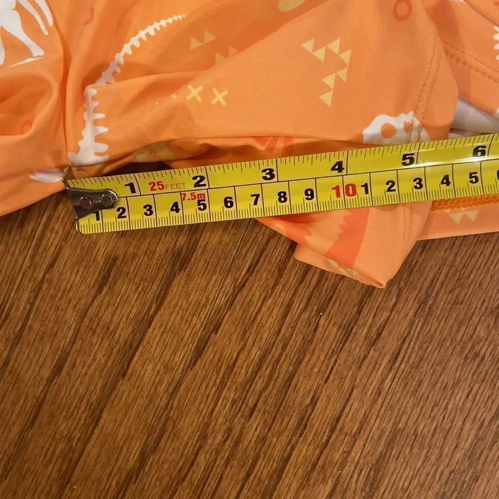 NWOT boys or girls swim shorts size 152 which is an 11/12 - dinosaurs, orange